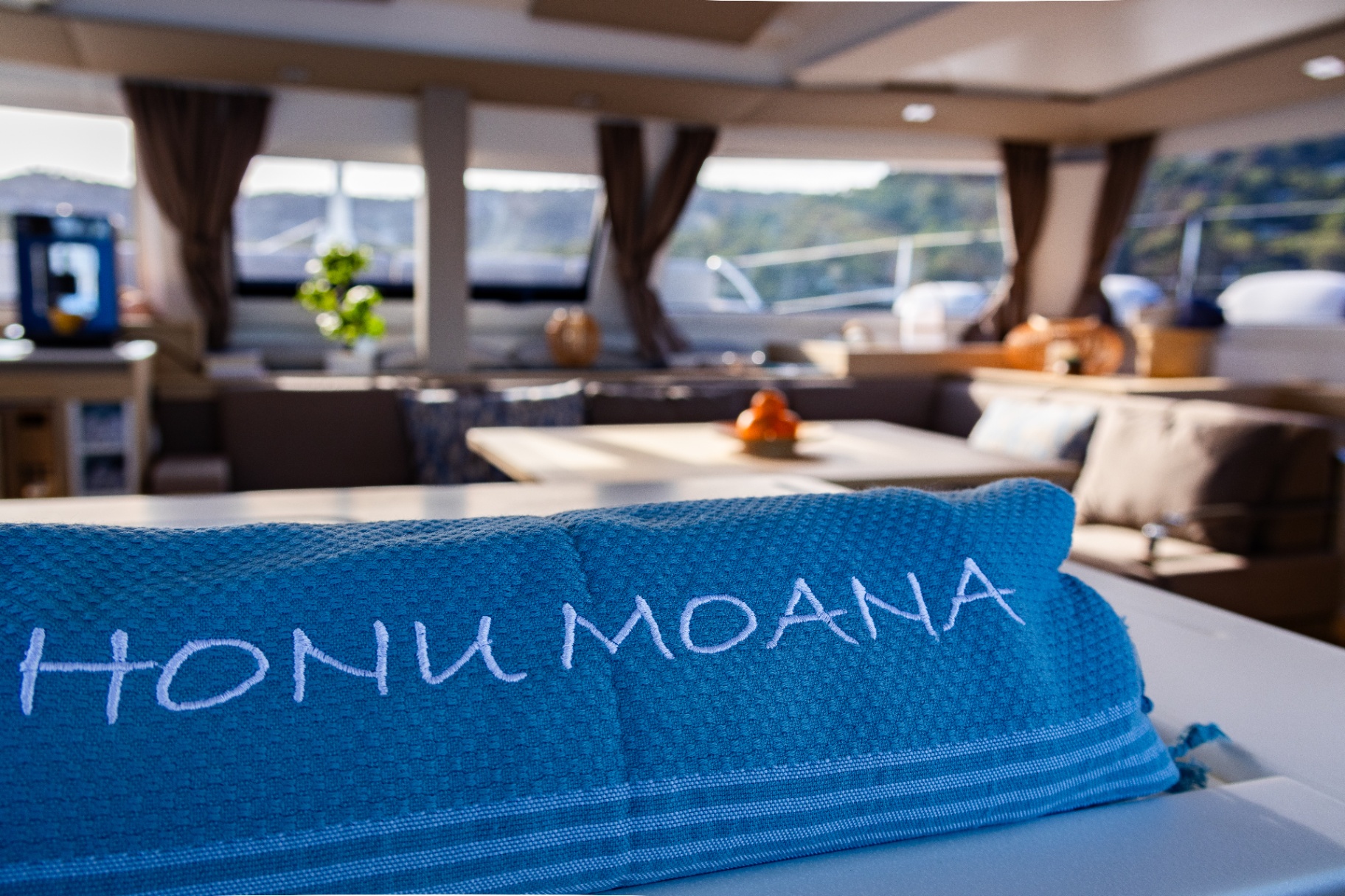 HONU MOANA embroidered towel in the yacht's saloon
